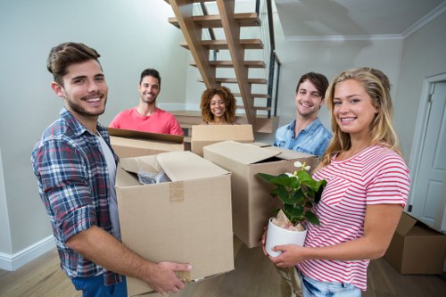 Removal team planning a St Lukes home move with packed boxes