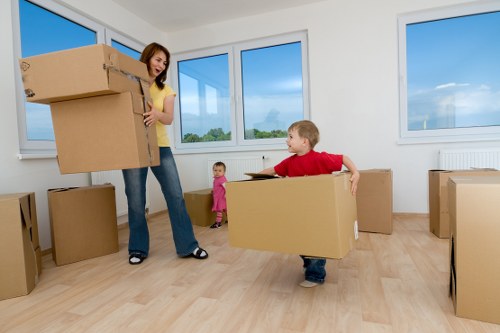 Preparing boxes and furniture for collection by a man with van