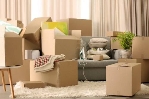Packed office equipment and labelled boxes ready for a St Lukes business move